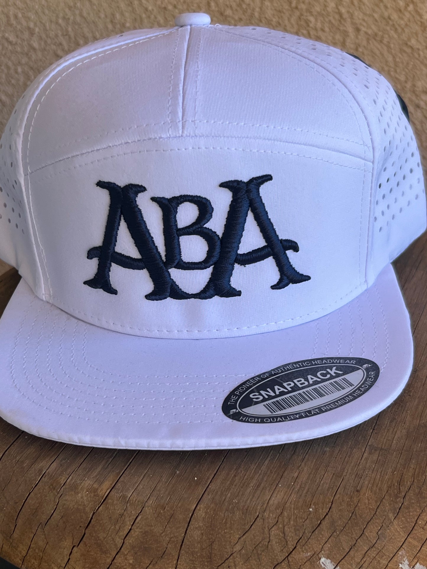 ABA Snapback Hat | White (Logo: Navy ABA)